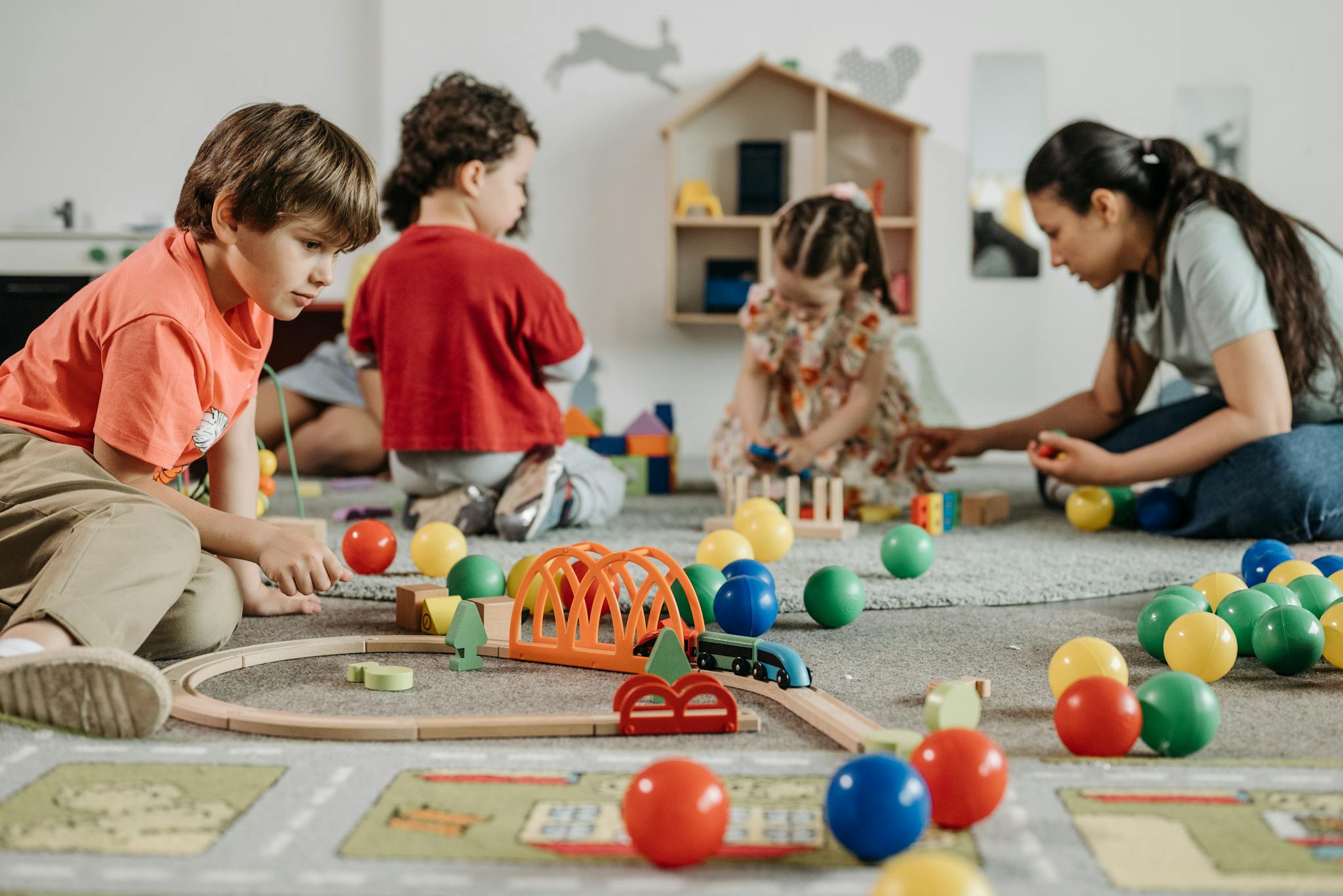 Kids playing with colorful toys in a kindergarten setting, fostering creativity and teamwork.